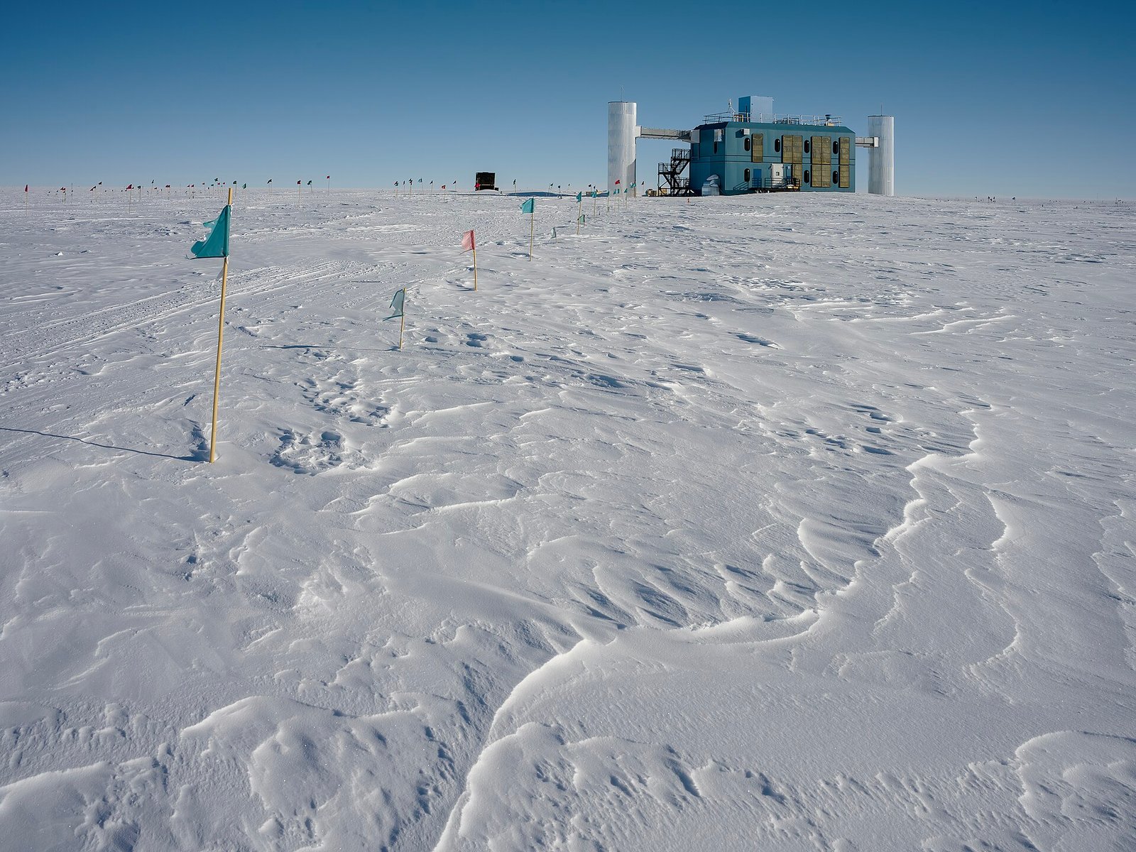 The IceCube Neutrino Observatory building (IceCube Lab) at the Amundsen-Scott South Pole Station, Antarctica — the cubic-kilometre neutrino detector that won Francis Halzen the 2026 Nobel Prize in Physics